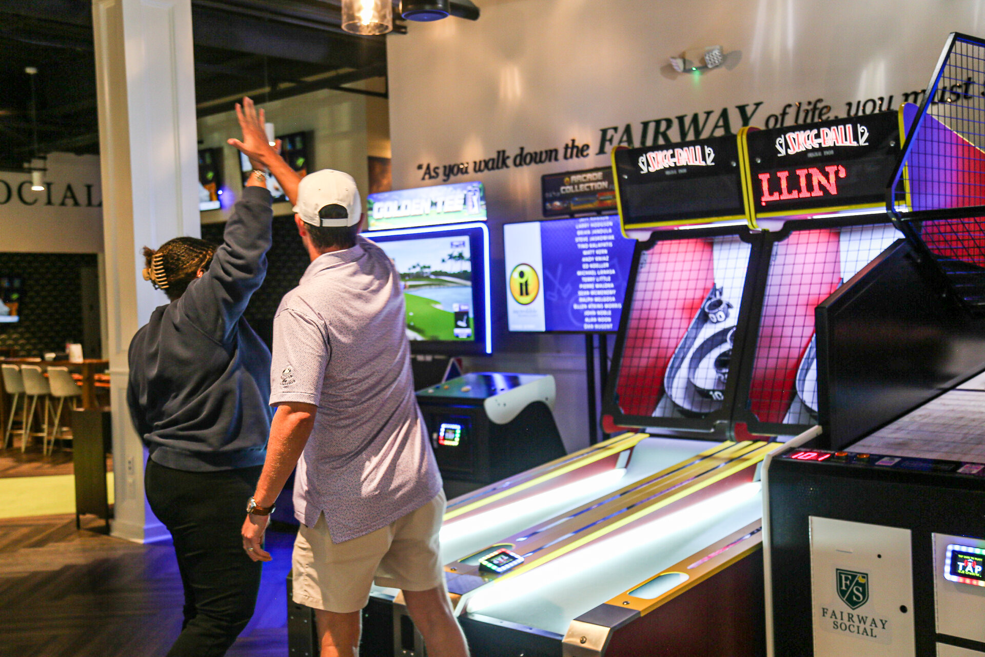 group playing skee ball